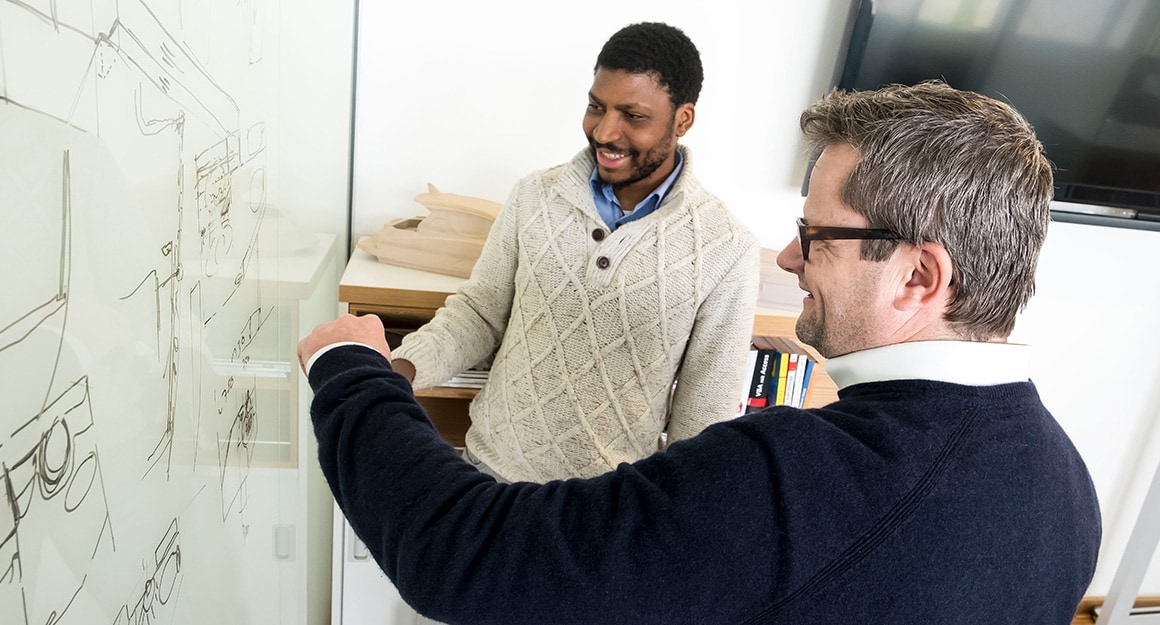 BAVARIA YACHTS Productmanager Pascal Kuhn discussing plan with a colleague